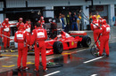Michael Schumacher makes his stop and go penalty on the last lap, winning the race in the pitlane