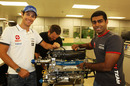 Karun Chandhok and Bruno Senna with an engine at the Cosworth factory