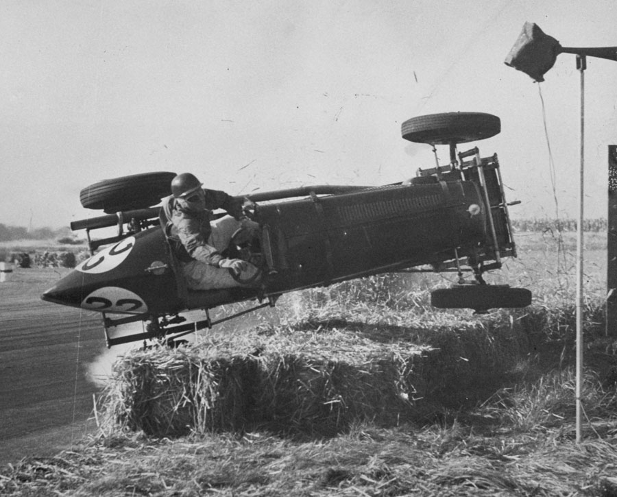 A British ERA racing car, driven by Geoffrey Ansell in mid-air during a crash 