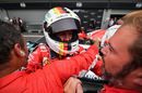 Race winner Sebastian Vettel cerebrates with Ferrari in parc ferme