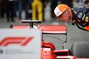 Max Verstappen inspeacts the Ferrari in parc ferme