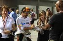 Fernando Alonso signs autographs for fans