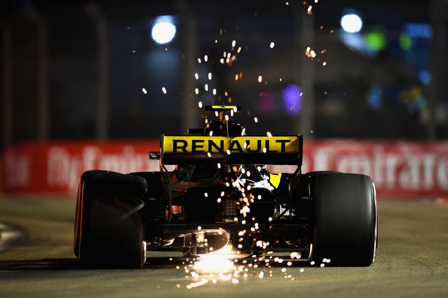 Sparks fly behind Carlos Sainz
