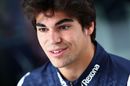 Lance Stroll talks to the media in the Paddock