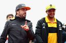 Fernando Alonso talks with Carlos Sainz on the drivers parade
