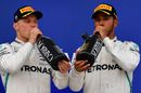 Race winner Lewis Hamilton and Valtteri Bottas celebrate on the podium with the champagne