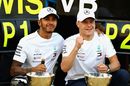 Race winner Lewis Hamilton and Valtteri Bottas celebrate with their team