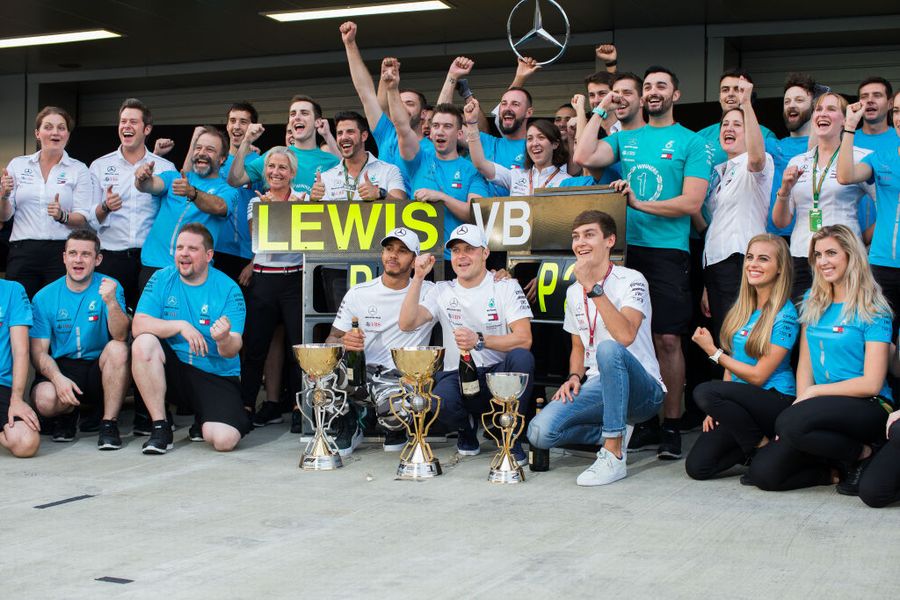 Race winner Lewis Hamilton with Valtteri Bottas and George Russell celebrate with the team