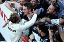 Race winner Lewis Hamilton celebrates in parc ferme with the team