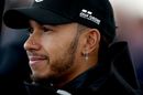 Lewis Hamilton looks relaxed in the paddock
