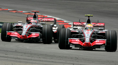 Lewis Hamilton leads McLaren team-mate Fernando Alonso 