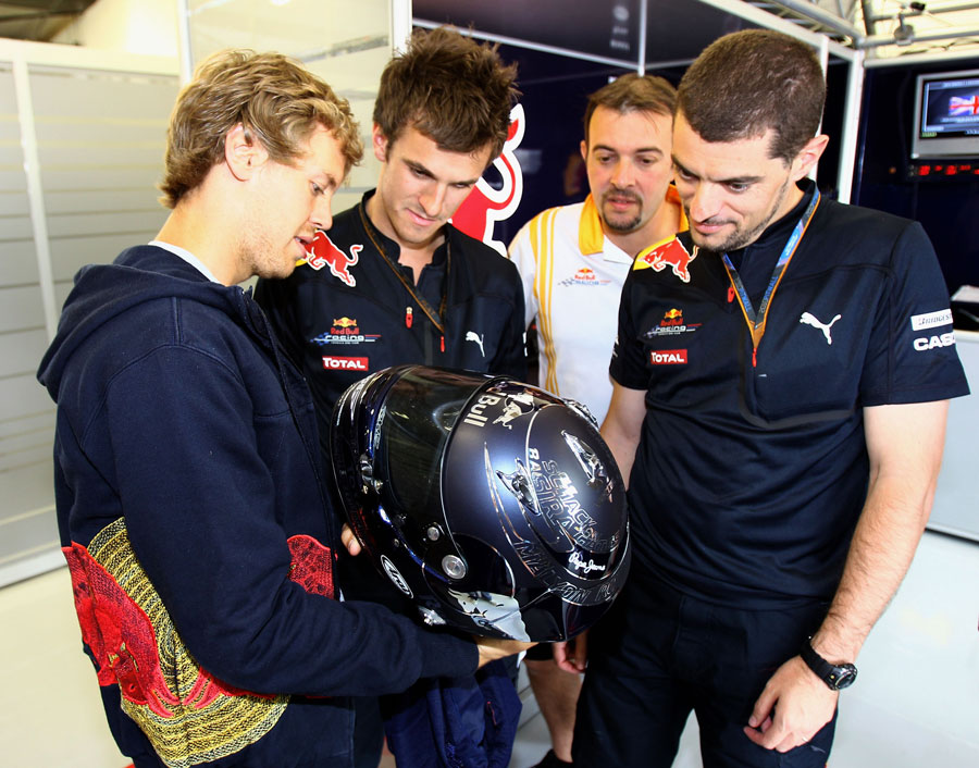 Sebastian Vettel Helmet 2011. Sebastian Vettel inspects his