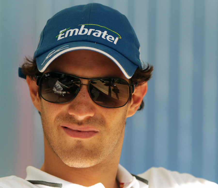 Bruno Senna relaxes in the paddock
