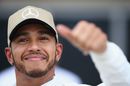 Pole sitter Lewis Hamilton celebrates in parc ferme