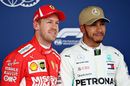 Sebastian Vettel and Pole sitter Lewis Hamilton pose for a photo in parc ferme