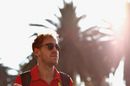 Sebastian Vettel walks in the Paddock