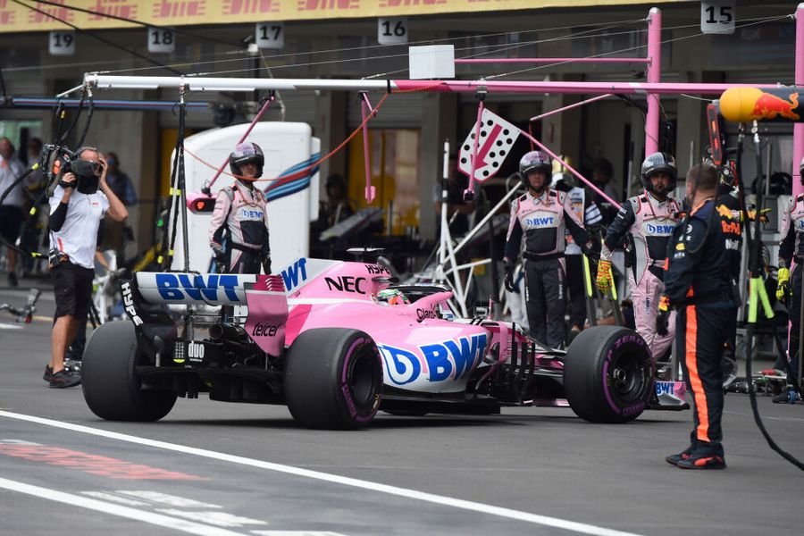 Sergio Perez returns to pits