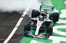 Lewis Hamilton celebrates winning the 2018 F1 World Drivers Championship by performing donuts