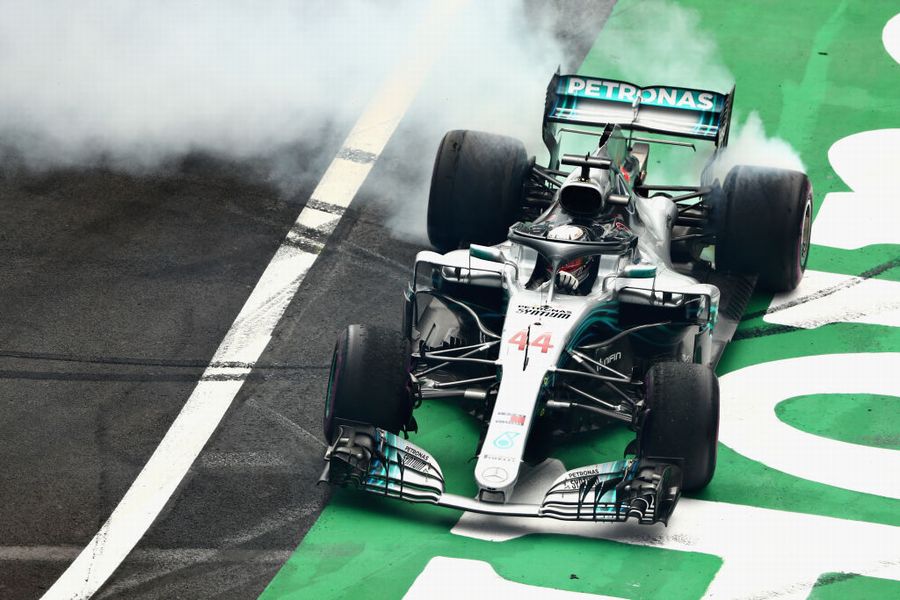 Lewis Hamilton celebrates winning the 2018 F1 World Drivers Championship by performing donuts
