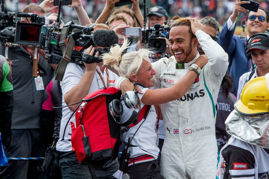Lewis Hamilton celebrates in parc ferme with the team