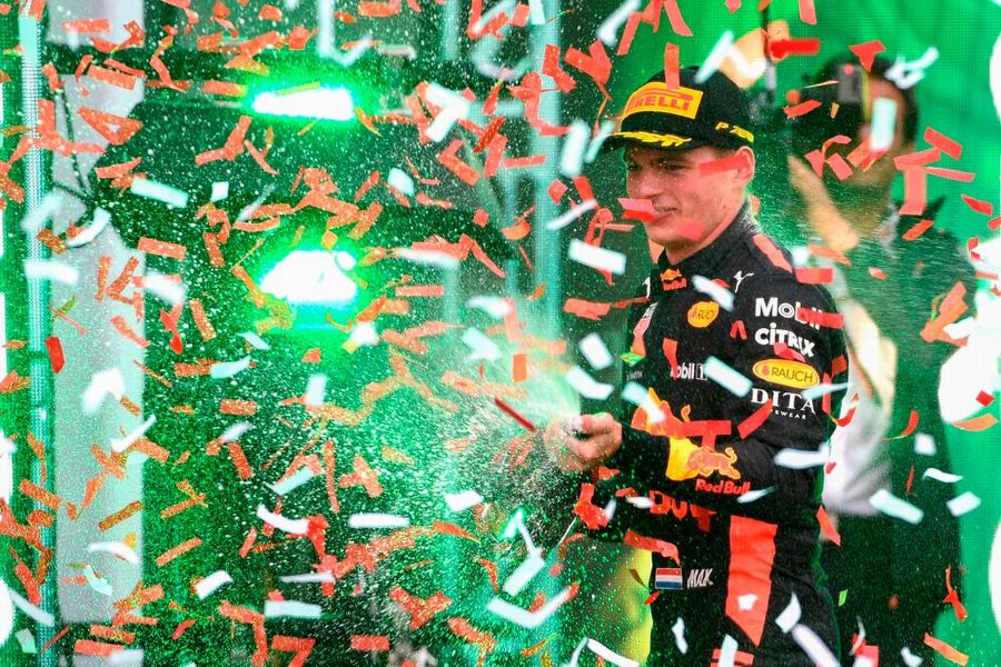 Race winner Max Verstappen celebrate on the podium with the champagne