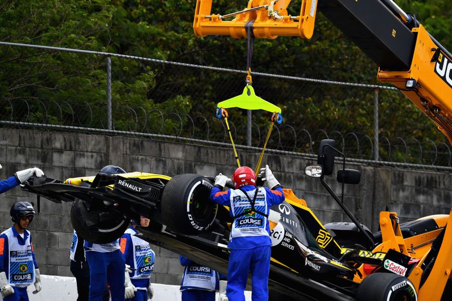 The car of Nico Hulkenberg is removed from the circuit after he crashed