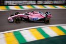 Sergio Perez heads down the pit lane in the Force India