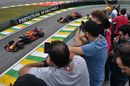Max Verstappen and Daniel Ricciardo heads down the pit lane in the Red Bull