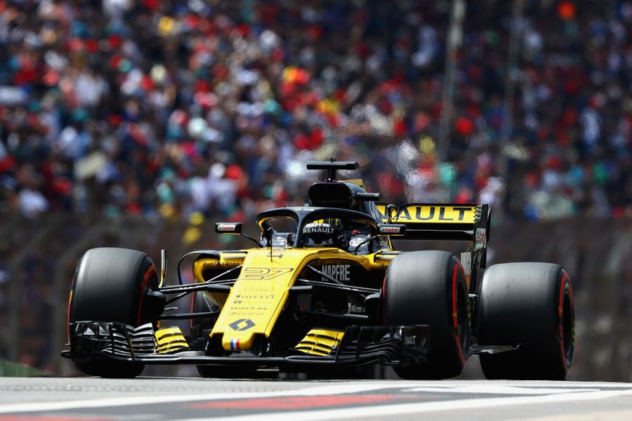 Nico Hulkenberg powers down the pit lane in the Renault