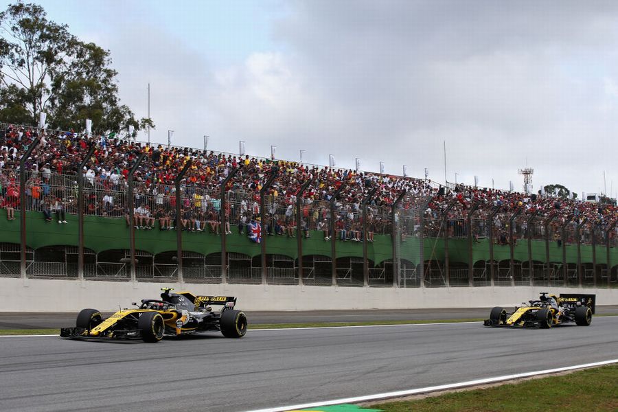 Carlos Sainz leads Nico Hulkenberg on track in the Renault