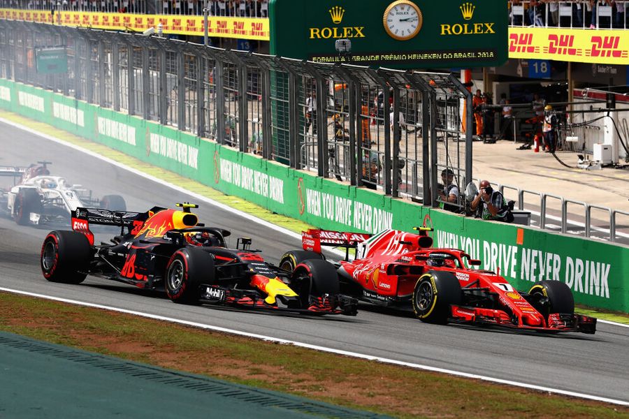 Kimi Raikkonen and Max Verstappen battle for position