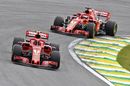 Kimi Raikkonen and Sebastian Vettel on track in the Ferrari