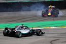 Lewis Hamilton passes as Max Verstappen spins after crashing