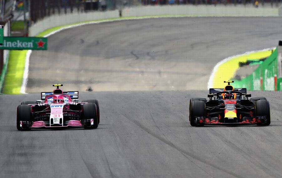 Esteban Ocon attempts to unlap himself from race leader Max Verstappen