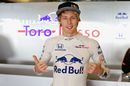 Brendon Hartley  poses for a photo in the garage