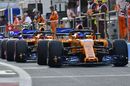 Fernando Alonso heads down the pit lane in the McLaren