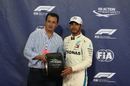 Pole sitter Lewis Hamilton receives the pole position award