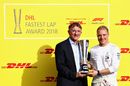 Valtteri Bottas is presented with the DHL Fastest Lap trophy after recoring the most fastest laps during the 2018 F1 season