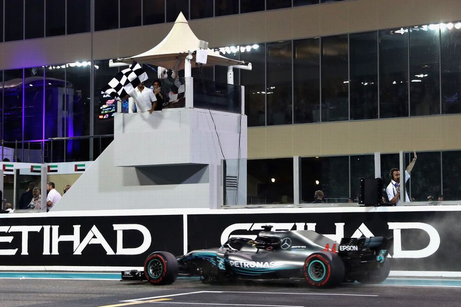 Lewis Hamilton takes the chequered flag and the win