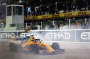 Fernando Alonso performs donuts on the pit straight