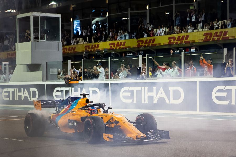 Fernando Alonso performs donuts on the pit straight