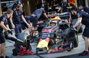 Red Bull mechanics wheel Max Verstappen back into the garage