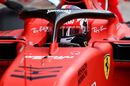 Charles Leclerc sits in the Ferrari cockpit