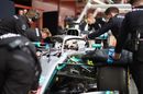 Mercedes mechanics wheel Lewis Hamilton back into the garage