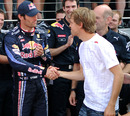 Mark Webber and Sebastian Vettel shake hands in front of their team
