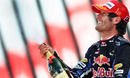 Mark Webber sprays the champagne on the podium