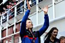 Daniil Kvyat waves to fans in the Paddock