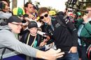 George Russell poses for selfies with fans
