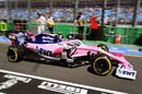 Lance Stroll powers down the pit lane in the Racing Point