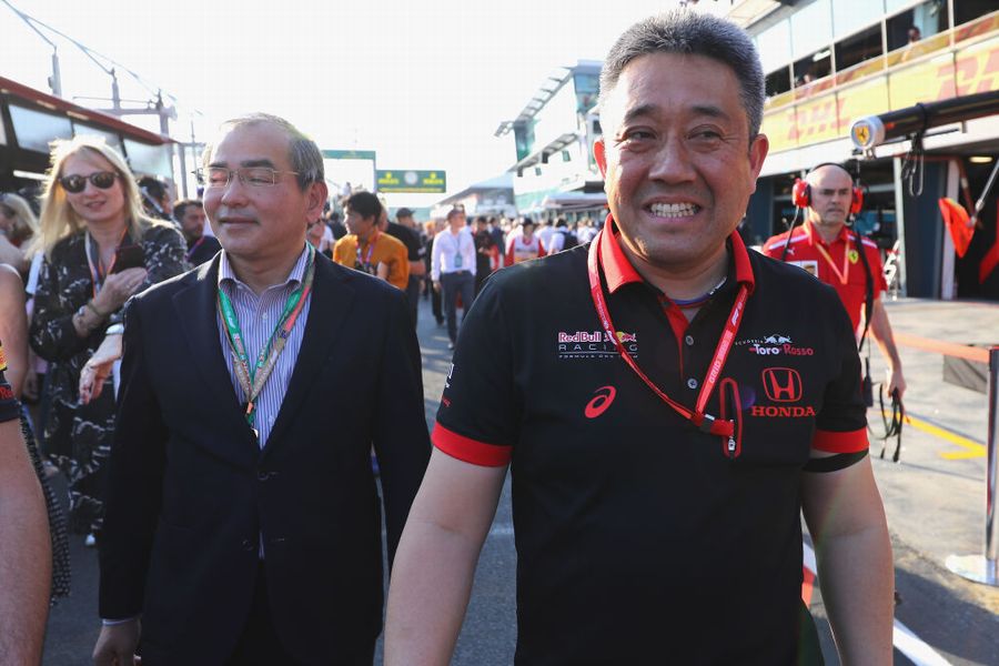 Masashi Yamamoto and Takahiro Hachigo walk in the Pitlane after the race